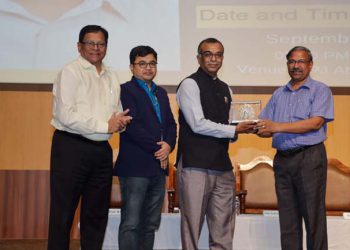 Registrar Premakumar presenting the memento to Dr. Nagmare